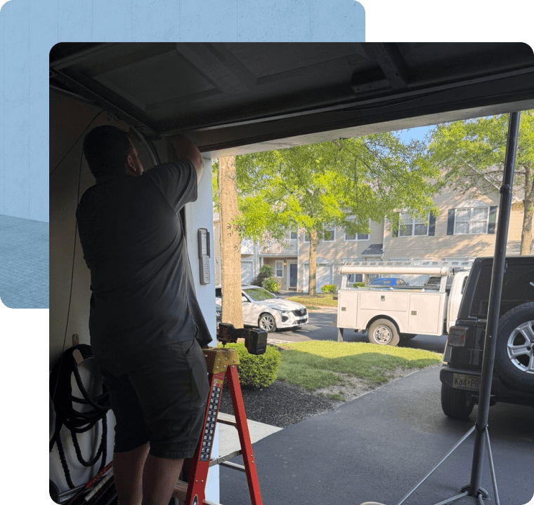 Titan Garage Services technician performing a garage door repair in Ocean County NJ